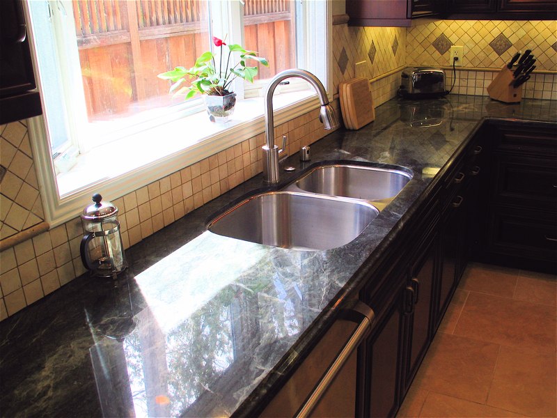 notice the bay window flower decoration, nice counter top, under counter sink