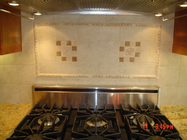 notice the nice, neat, cemetrical, clean tile job, plenty of lighting by the vent hood
